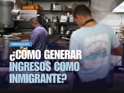Un inmigrante haitiano con TPS, a la izquierda, prepara comida