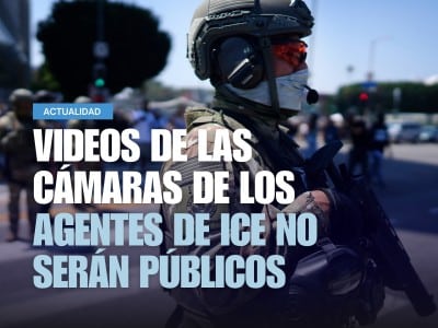 Un agente de ICE observa una manifestación
